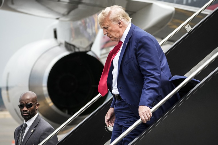 Image: Former President Donald Trump arrives at Ronald Reagan Washington National Airport, on Aug. 3, 2023, in Arlington, Va.