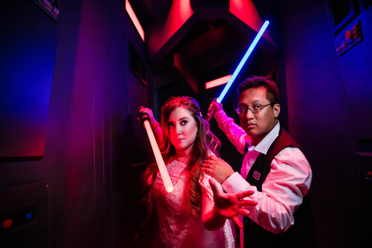 For their first vow renewal at Disneyland Resort, Shellie and her husband picked a Star Wars theme and took pictures with lightsaber props.