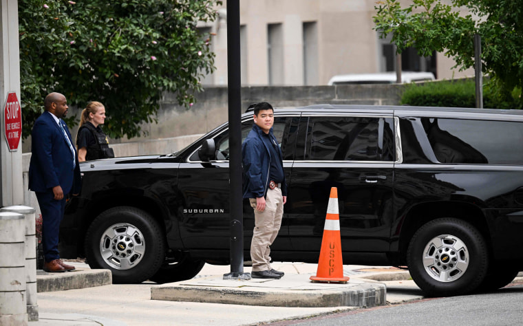 The SUV with Former President Donald Trump pulls into the underground parking of the E. Barrett Prettyman Courthouse in Washington on Aug. 3, 2023.