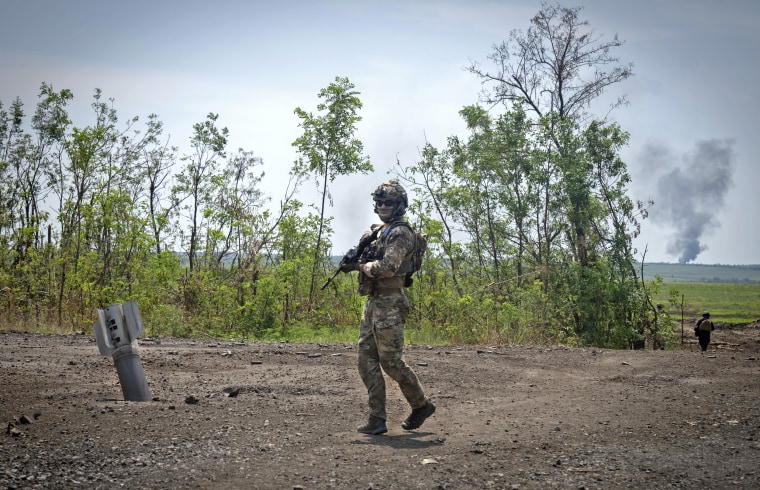 A Ukrainian soldier walks at his position on the front line in the Zaporizhzhia region in Ukraine on June 23.