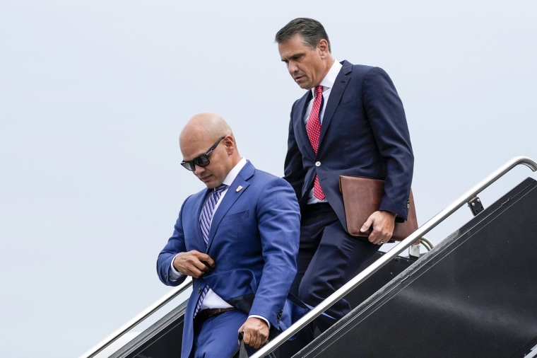 Former President Donald Trump's valet Walt Nauta and attorney Todd Blanche arrive with Trump at Ronald Reagan Washington National Airport in Arlington, Va., on Aug. 3, 2023.