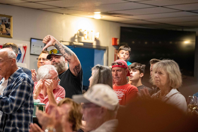 Supporters of former US president Donald Trump react during a town hall meeting by Presidential hopeful and former Vice President Mike Pence at American Legion Hall Post 27 in Londonderry, New Hampshire, on August 4, 2023.