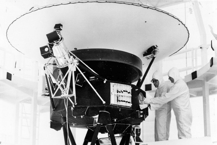 In this Aug. 4, 1977, photo provided by NASA, the "Sounds of Earth" record is mounted on the Voyager 2 spacecraft in the Safe-1 Building at the Kennedy Space Center, Fla. On Wednesday, Aug. 2, 2023, NASA's Deep Space Network sent a command to correct a problem with its antenna. It took more than 18 hours for the signal to reach Voyager 2 _ more than 12 billion miles away _ and another 18 hours to hear back. On Friday, Aug. 4, the spacecraft started returning data again.