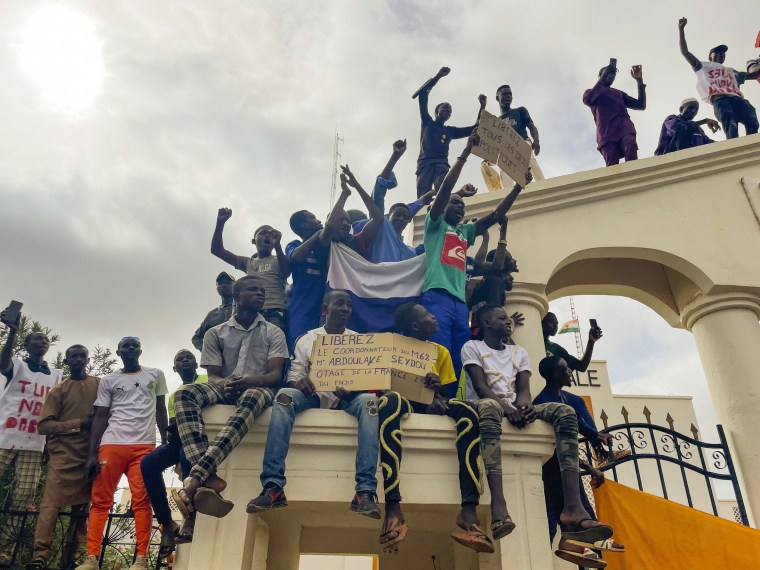 The march falls on the West African nation's independence day from its former colonial ruler, France, and as anti-French sentiment spikes, more than one week after mutinous soldiers ousted the country's democratically elected president. 