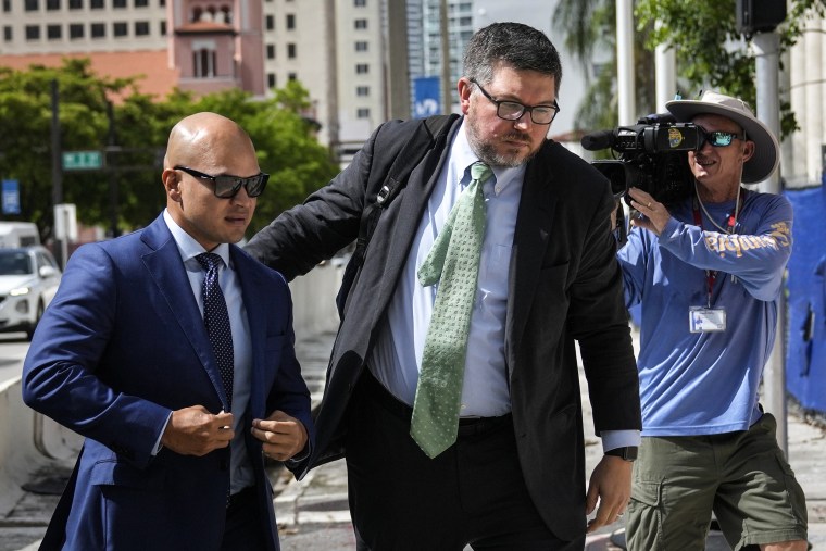 Image: Walt Nauta, left, a valet to former President Donald Trump, arrives for his arraignment along with defense attorney Stanley Woodward, at the James Lawrence King Federal Justice Building in Miami on July 6, 2023. 