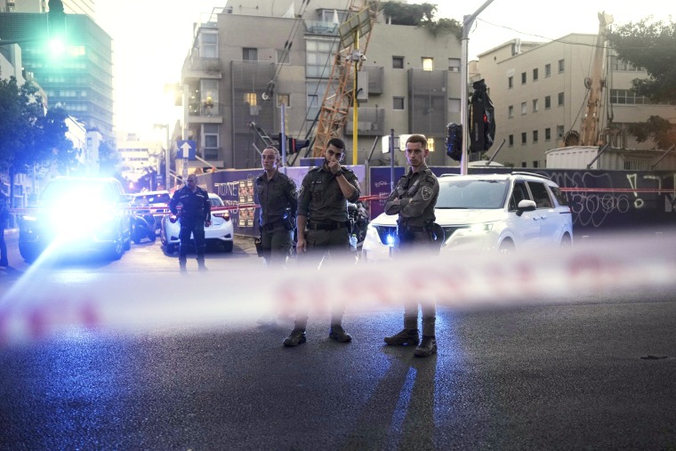 Israeli police inspect the site of a shooting in Tel Aviv