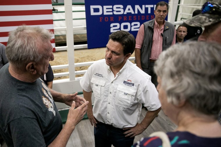 Image: DeSantis meets with voters at a campaign stop at Spanky's South Tama Livestock Auction in Iowa on Saturday.