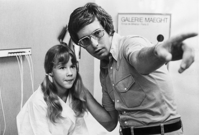 Director William Friedkin explaining the next scene to Linda Blair during the making of "The Exorcist" in 1972.