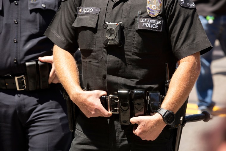 A Los Angeles police officer wears a body camera outside of City Hall in Los Angeles on May 1, 2020.