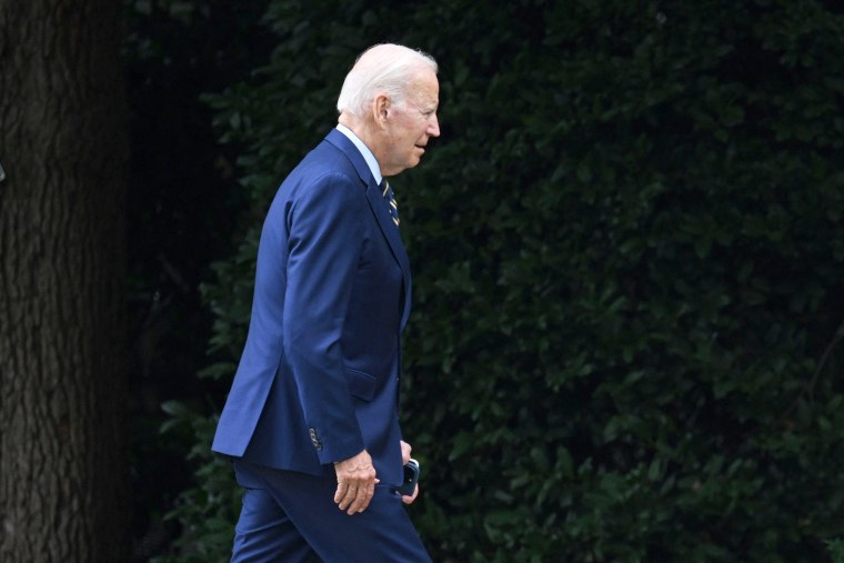 US President Joe Biden walks towards the Oval Office after disembarking Marine One, as he returns to the White House in Washington, DC, on August 7, 2023.
