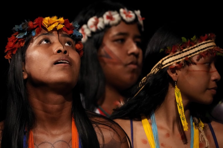 Tembe Indigenous youths perform a ritual dance at Theater da Paz in Belem, Brazil