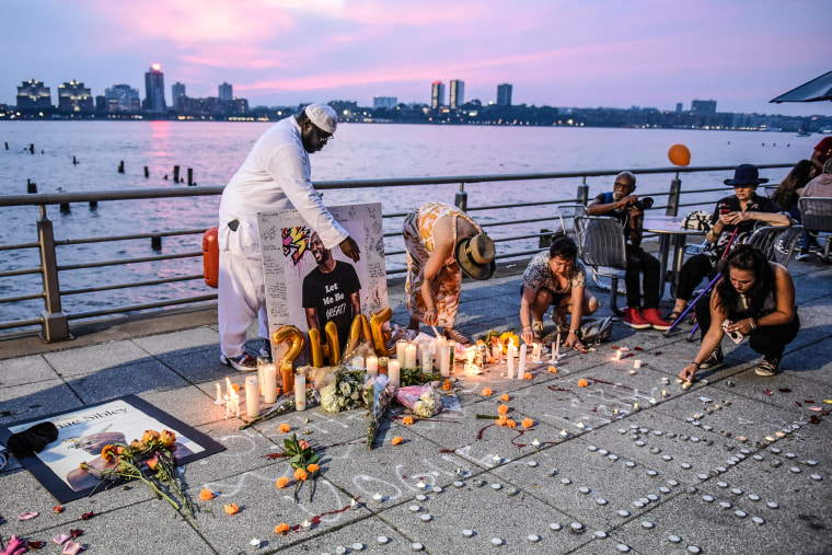 Image: People create a makeshift memorial for O'Shae Sibley on Aug. 5, 2023 in New York.