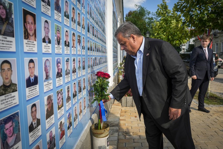 Republican presidential candidate former New Jersey Gov. Chris Christie lays flowers at the Wall of Remembrance to pay tribute to killed Ukrainian soldiers in Kyiv on Aug. 4, 2023.
