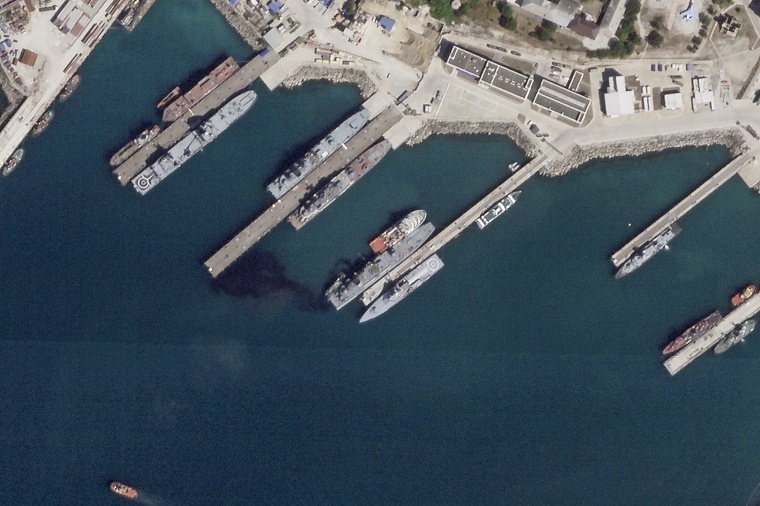 A satellite photo appears to show the damaged Russian landing vessel Olenegorsky Gornyak leaking oil while docked in Novorossiysk, Russia, on Aug. 4, 2023. Ukraine said its sea drones damaged the warship.