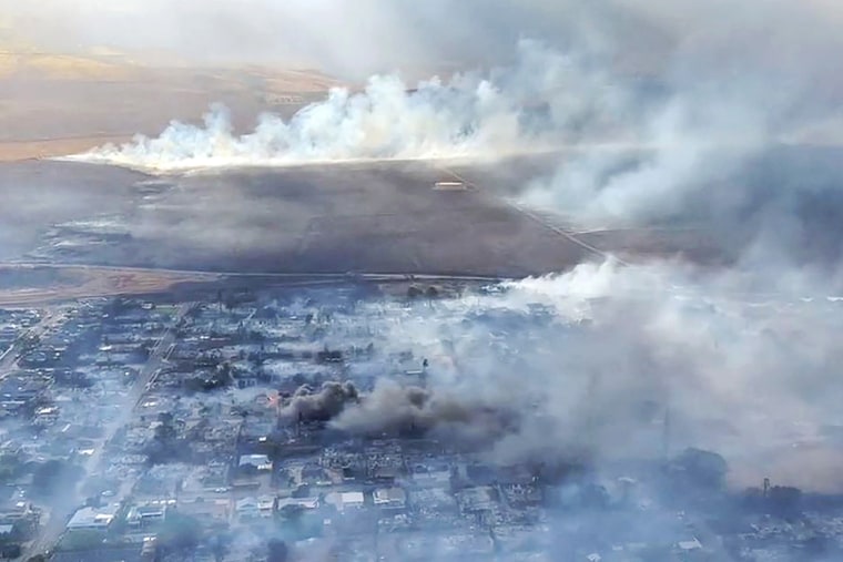 This handout video grab courtesy of Richard Olsten taken on August 9, 2023 shows smoke billowing from destroyed buildings as wildfires burn across Maui, Hawaii. At least six people have been killed in a wildfire that has razed a Hawaiian town, officials said Wednesday, as desperate residents jumped into the ocean in a bid to escape the fast-moving flames.
