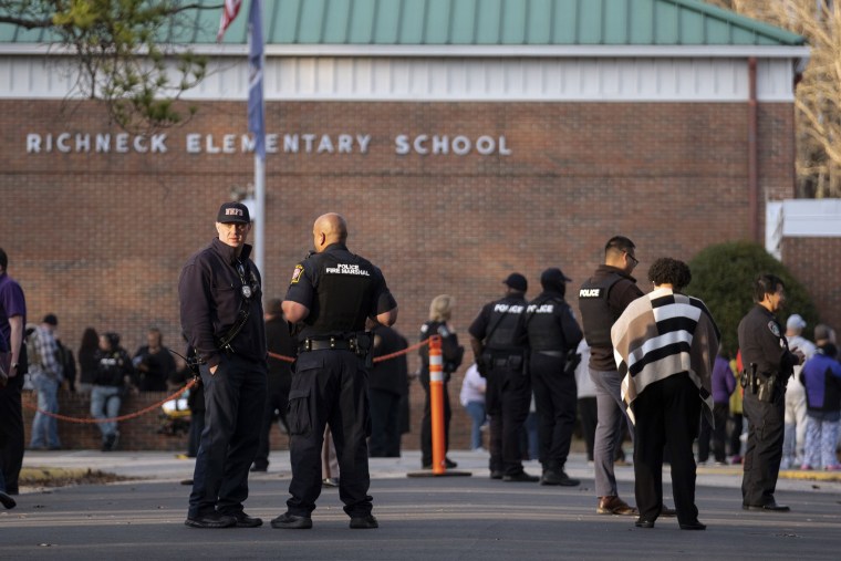 Police respond to a shooting that injured a teacher at Richneck Elementary
