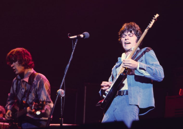 Rick Danko, left, and Robbie Robertson perform with The Band in 1976.