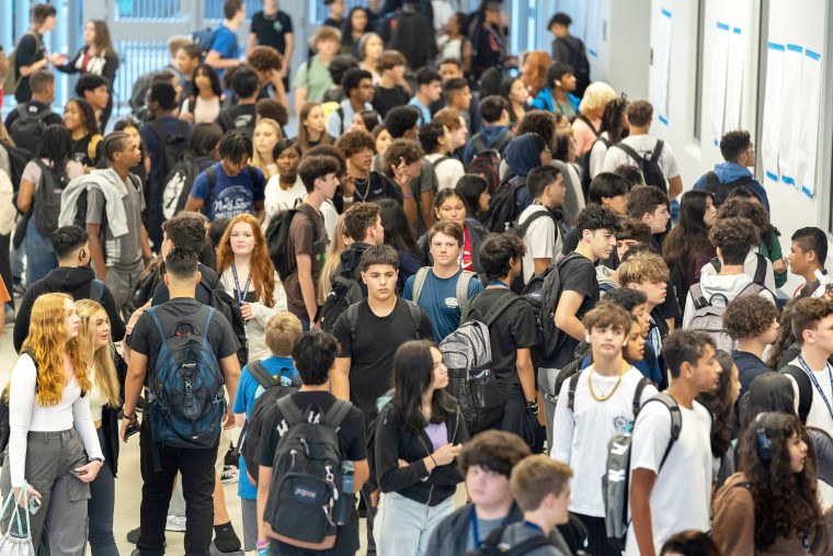 Students arrive for their first day of school at Dr. Joaquin Garcia High School in western Lake Worth Beach, Florida on August 10, 2023.