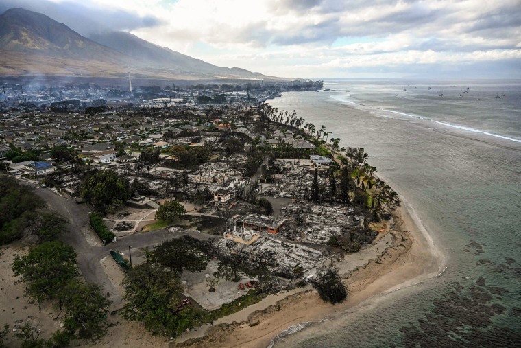 Image: Destroyed homes and buildings on the waterfront burned to the ground in Lahaina in the aftermath of wildfires in western Maui, Hawaii on Aug. 10, 2023.