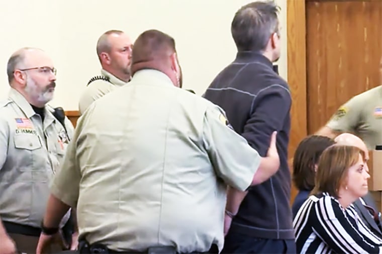 Timothy Bliefnick is handcuffed in court after being found guilty in Adams County, Ill., on May 31, 2023.