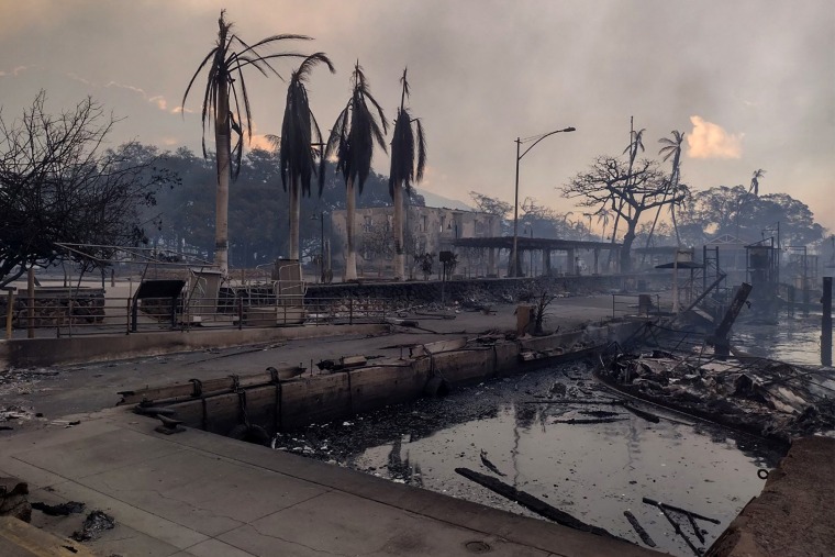Image: A charred boat and a scorched waterfront in Lahaina on Wednesday.
