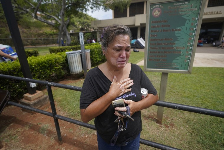 Image: Myrna Ah Hee at an evacuation center in Wailuku on Thursday. Her home in Lahaina was spared, but the homes of many relatives were destroyed.