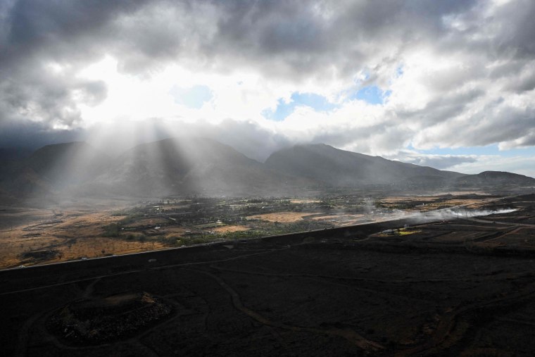 Image: A burned hillside in Lahaina as clouds break on Wednesday.