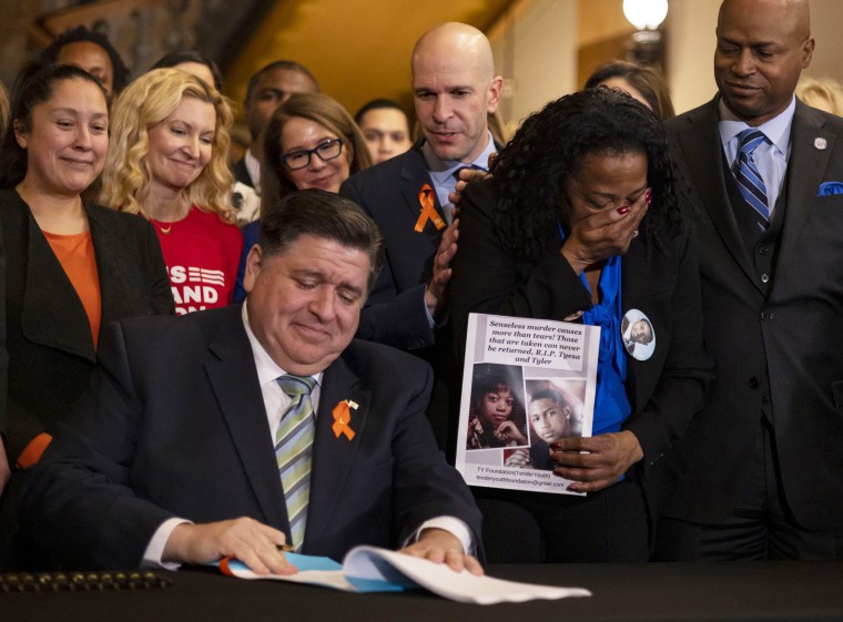 Gov. J.B. Pritzker signs comprehensive legislation to ban military-style firearms at the state Capitol