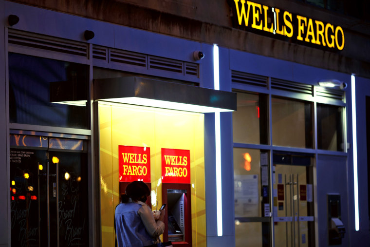 A pedestrian walks past a Wells Fargo bank in Washington, D.C.