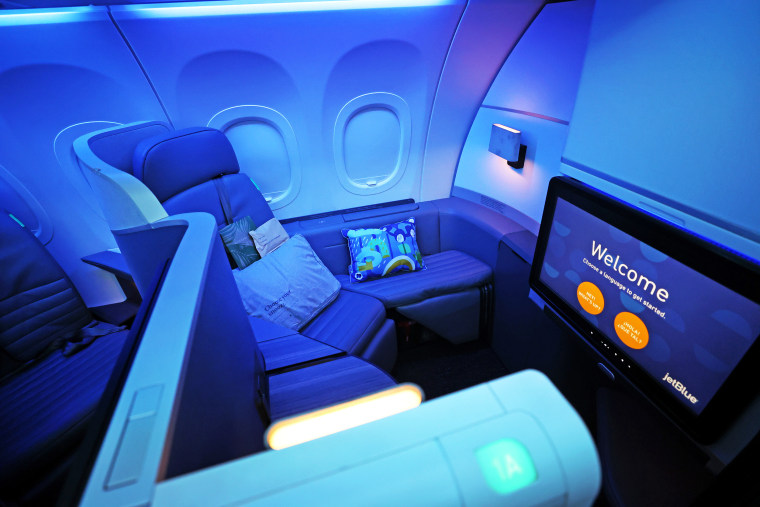 A First Class seating booth inside a JetBlues Airbus A321LR