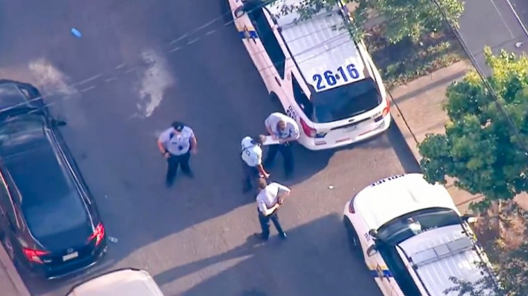 Police respond to a shooting at a basketball court in Philadelphia on Aug. 11, 2023.
