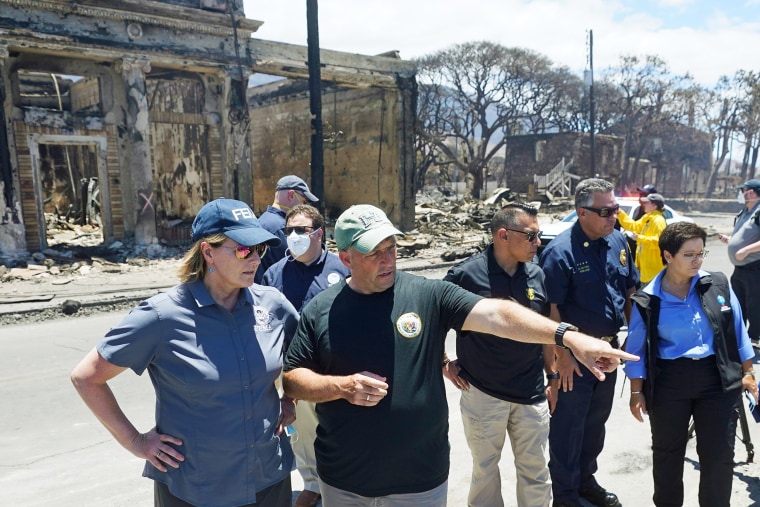 FEMA Administrator Deanne Criswell and Hawaii'sGovernor Josh Green during a tour of wildfire damage on Aug. 12, 2023, in Lahaina, Hawaii. 