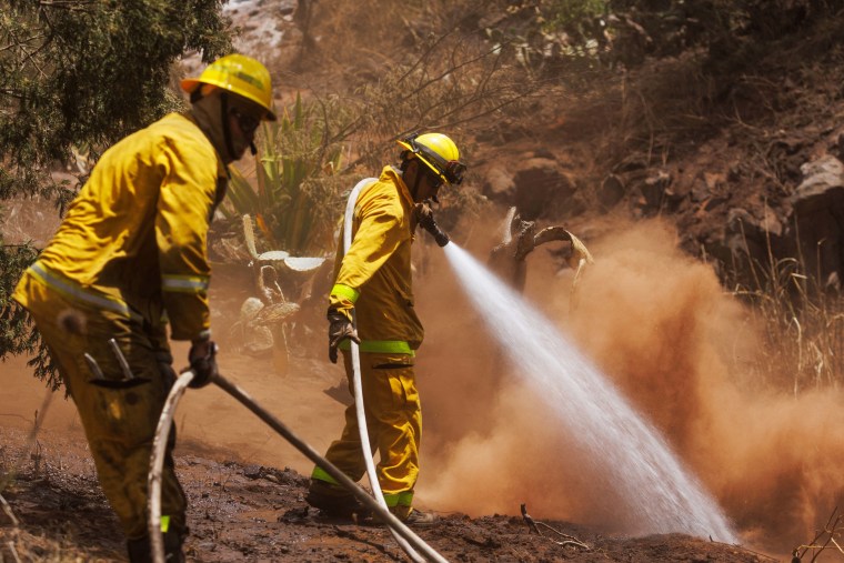 Maui County firefighters fight flare-up fires on the island