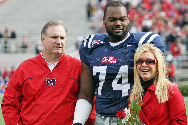 Michael Oher with Sean and Leigh Anne Tuohy prior to an Ole Miss game in 2008.