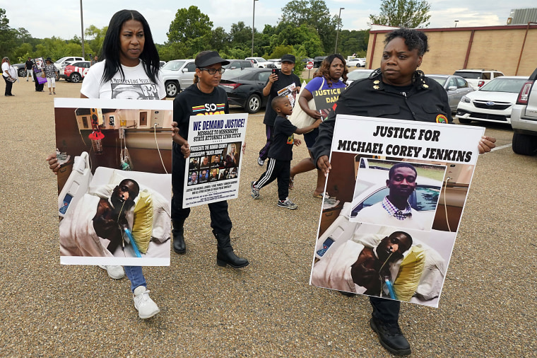 Activists march towards the Rankin County Sheriff's Office in Brandon, Miss.