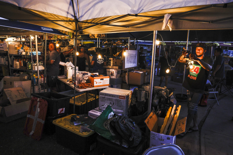 Lahaina, Maui, Monday, August 14, 2023 - A tent on the front yard of Archie Kalepa's home serves as a distribution center of food and supplies for victims of the recent devastating wildfires.