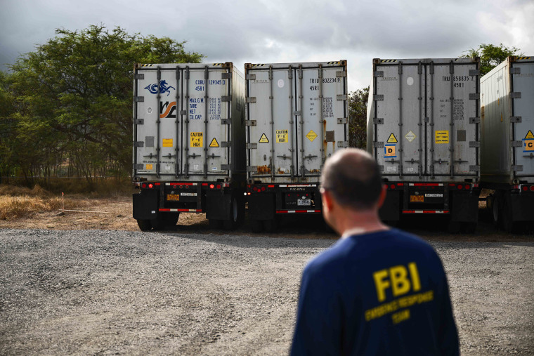 On the afternoon of August 14, two additional refrigerated containers arrived for a total of five containers as local authorities and FBI Evidence Response Team (ERT) agents were on site. The death toll in Hawaii's wildfires rose to 99 and could double over the next 10 days, the state's governor said August 14, as emergency personnel painstakingly scoured the incinerated landscape for more human remains.