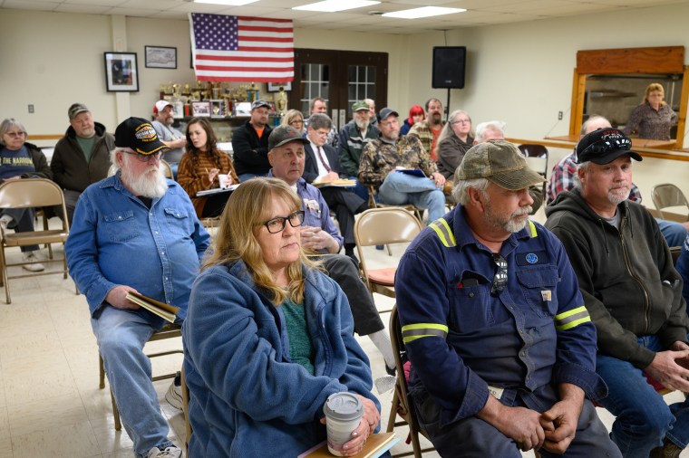 Tammy Yoders with her husband, Bill, and Tim Brady during a town  meeting led by the Center for Coalfield Justice in New Freeport, Pa., on March 29, 2023.