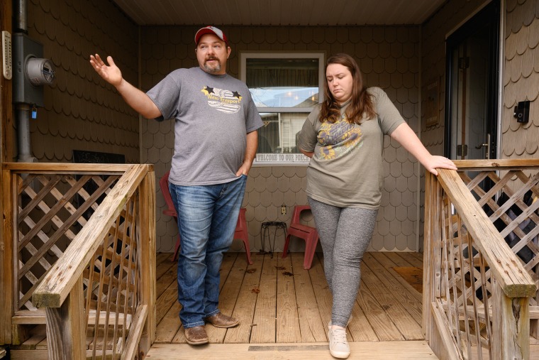  Paige and Joe Moore on the front porch of their home on March 29, 2023 in New Freeport, Pa. 