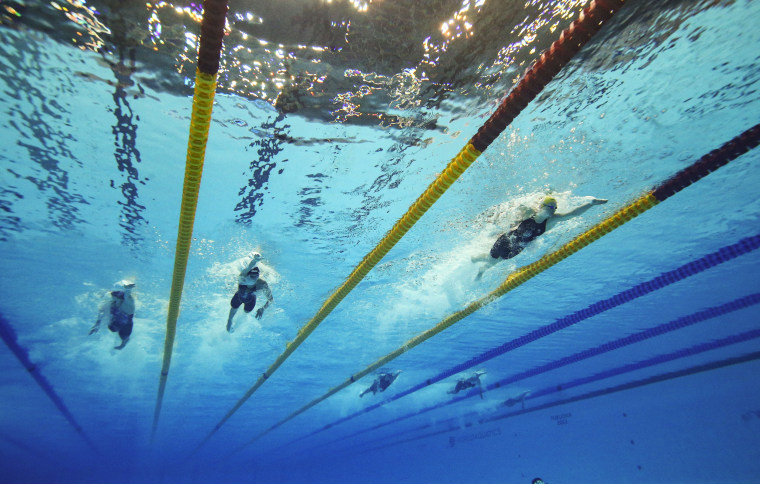 Swimmers race during a freestyle relay at the World Aquatics Championships
