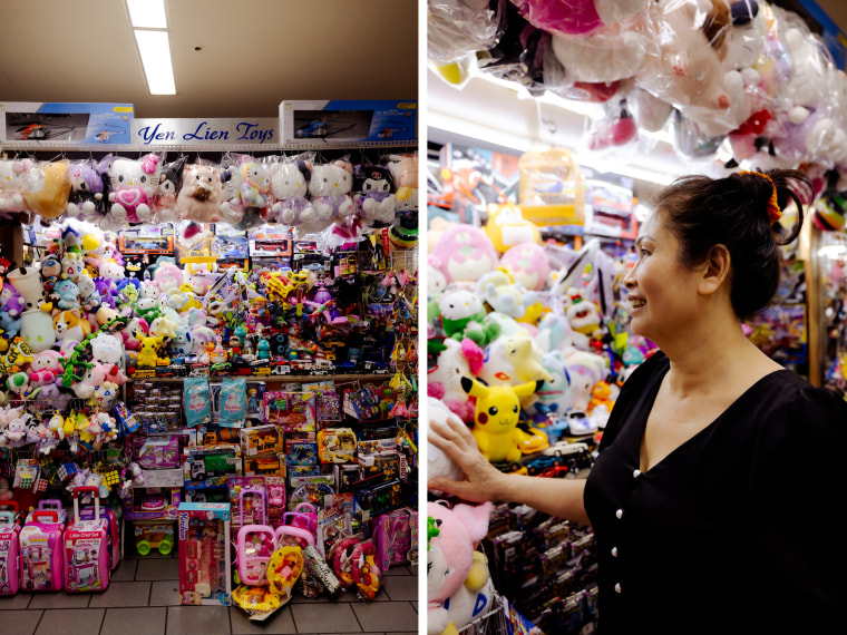 A shop owner looks at her toy store inside the Asian Garden Mall in Westmisnter, Calif.