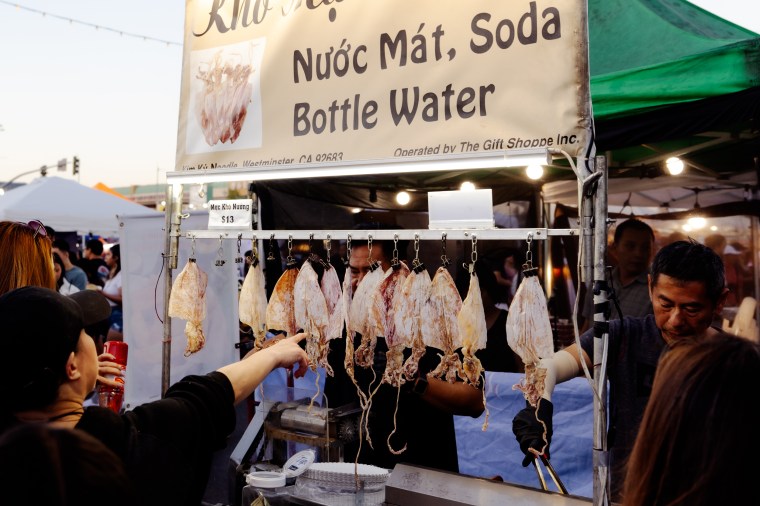 Customers shop for Vietnamese street food at the Little Saigon Night Market