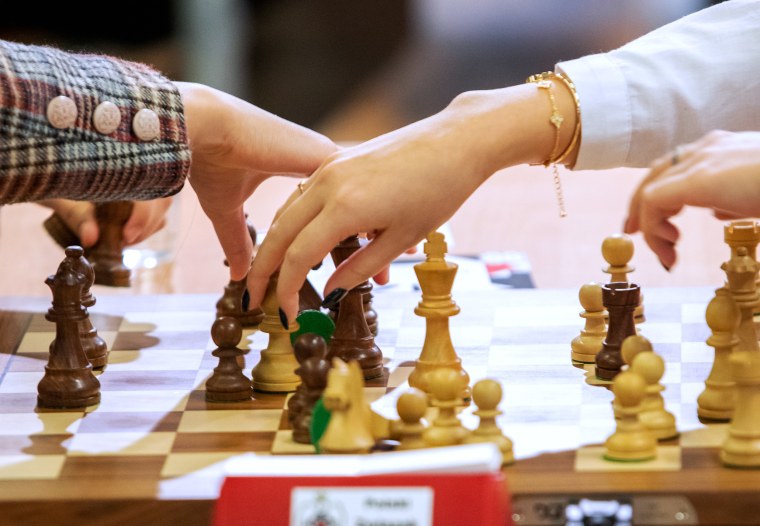 woman studying the next chess move, Stock image