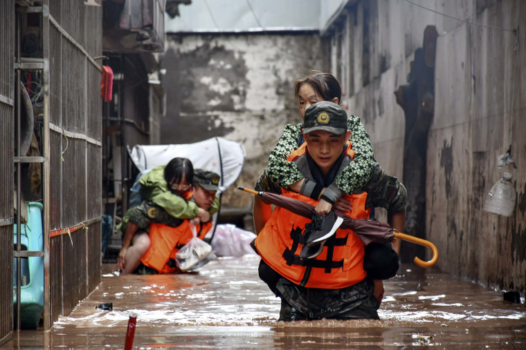 Heavy flooding has displaced thousands of people around China as the capital had a relative respite from sweltering heat.