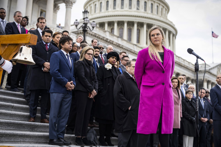 Erin Smith, the widow of D.C. Metropolitan Police Officer Jeffrey Smith, is recognized during a ceremony to mark the of the second anniversary of January 6th riot at the U.S. Capitol on Jan. 6, 2023.