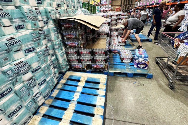 Customers buy emergency supplies at Costco