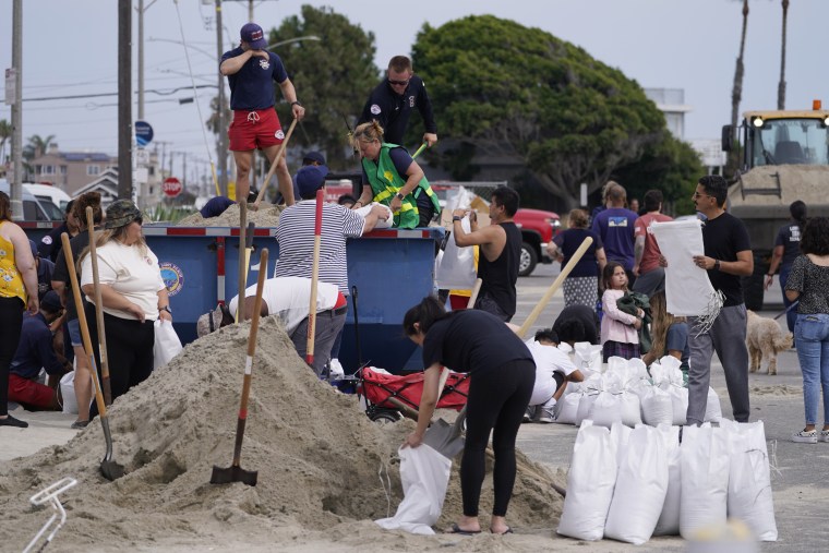 Long Beach lifeguards fill up sandbags for residents ahead of Hurricane Hilary, in Long Beach, Calif., Saturday, Aug. 19, 2023. 