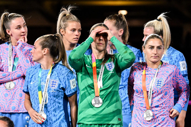 England's players stand on the podium after receiving second place medals following their loss to Spain in the Women's World Cup in Sydney on Aug. 20, 2023.