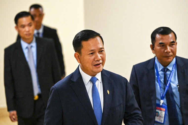 Cambodia's Prime Minister-designate Hun Manet (C) walks as he attends a parliamentary meeting at the National Assembly building in Phnom Penh on August 22, 2023. Cambodia's parliament on August 22 elected long-time ruler Hun Sen's eldest son as the country's new prime minister, sealing a dynastic handover of power after last month's one-sided election.