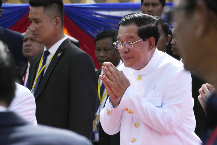 Cambodia Prime Minister Hun Sen, center, greets in front of the National Assembly in Phnom Penh, Cambodia, Monday, Aug. 21, 2023. Cambodian king on Monday presided over the opening of the first session of National Assembly in Phnom Penh.